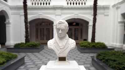 A bust of Sir Thomas Stamford Raffles, the British founder of modern Singapore, stands at the Raffles Hotel. Bloomberg