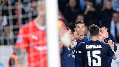 Real Madrid's Cristiano Ronaldo celebrates with teammates after scoring in their Champions League victory over Malmo on Wednesday. Jonathan Nackstrand / AFP / September 30, 2015