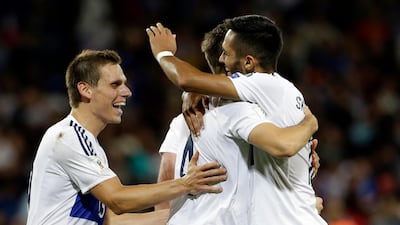 Luxembourg players, Mathias Janish, left, Kevin Maiget and Aldin Skenderovic, right, celebrate at the end of the World Cup Group A qualifier against France where they held the French to a 0-0 draw at Stadium municipal in Toulouse. Claude Paris / AP Photo