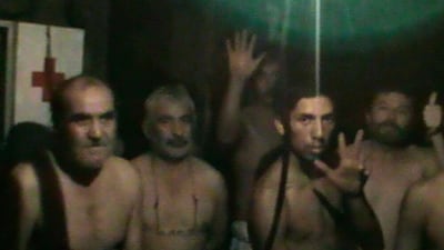 The trapped miners in video frame grab taken August 29, 2010. Chile was looking at ways to speed up the rescue of 33 miners trapped deep underground for 24 days who officials have said might have to wait three to four months to see the light of day. REUTERS