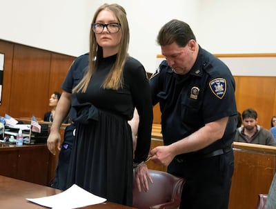 Anna Sorokin is handcuffed during her sentencing. Reuters