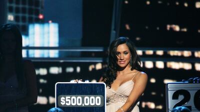 Meghan while working as a host on American quiz show 'Deal Or No Deal' in 2006. Getty Images