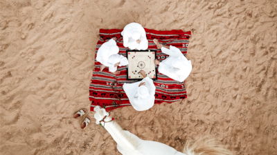 This photo shows children playing the traditional Emirati game of Carrom. It was taken by photographer Safia Al Zaabi during quarantine. Photo by Safia Al Zaabi