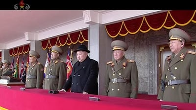 Kim Jong Un watches the military parade in Pyongyang. KRT / AP