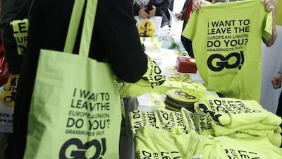 A stall holder sells t-shirts with a slogan urging people to leave the EU. Phil Noble / Reuters
