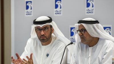 ADNOC group's CEO, Dr Sultan Ahmed Al Jaber (left) and Abdulmunim Al Kindy, director of upstream at Adnoc (right) speak during a press conference to announce the upcoming launch of an oil and gas licensing round. Victor Besa / The National