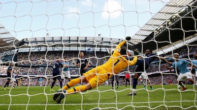 Tottenham Hotspur's Danny Rose clears the ball during the Premier League match at The Etihad Stadium, Manchester. PA
