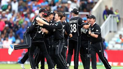 New Zealand players celebrate after India's MS Dhoni by Martin Guptill's direct hit. PA Photo