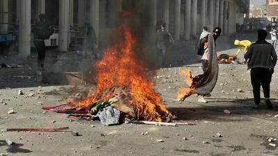 Protesters set fires during clashes between security forces and anti-government protesters. AP Photo