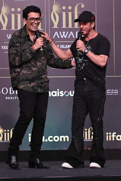Bollywood director and producer Karan Johar and actor and producer Shah Rukh Khan at a press conference for the IIFA Festival in Mumbai. AFP