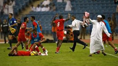 The Bahrain team celebrate after clinching a thrilling 2-2 draw with Saudi Arabia at the King Fahd International stadium in Riyadh on Wednesday. The result means Bahrain will face New Zealand over two legs, with a place in the World Cup finals in South Africa next year at stake.
