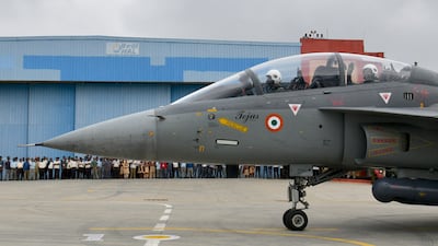 A Tejas jet carrying Indian Defence Minister Rajnath Singh taxis to the runway at HAL Airport in Bangalore.