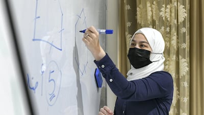 A volunteer teacher leads a lesson at the Lotus Retal centre in Abu Dhabi. All pictures by Khushnum Bhandari/ The National
