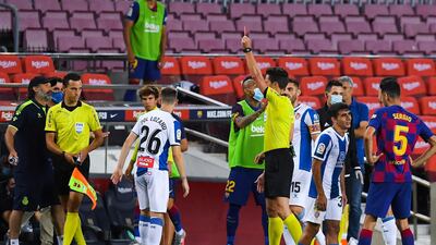 Pol Lozano of Espanyol is shown a red car by the referee. Getty Images