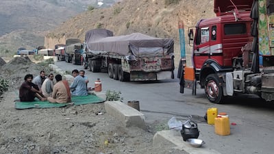 Truck drivers wait their turn to cross the border following its reopening in Torkham, Pakistan on Friday, Sept. 15, 2023. AP