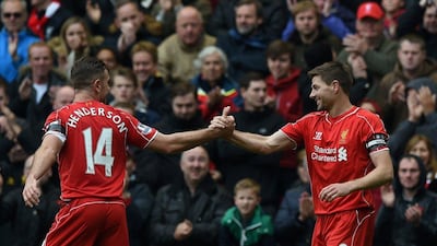 Liverpool's Jordan Henderson celebrates with Steven Gerrard after Gerrard's winning goal against QPR on Saturday. Paul Ellis / AFP / May 2, 2015