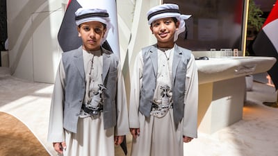 Two young visitors learn about the UAE's long-standing traditions