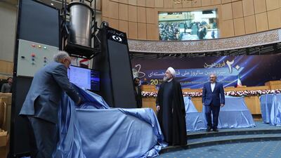 Iranian president Hassan Rouhani and head of Iran's nuclear technology organisation Ali Akbar Salehi unveiling nuclear technology achievements during the National Nuclear Technology Day in Tehran, Iran. EPA