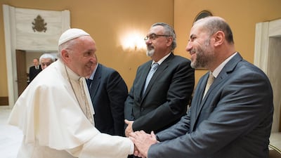 A handout picture provided by the Vatican newspaper L'Osservatore Romano shows Pope Francis (L) shaking hands with Mahmoud Al Habbash (R), the Palestinian supreme judge and adviser of president Mahmoud Abbas on Religious and Islamic Affairs, at the Vatican on December 6, 2017. EPA