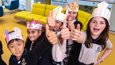 Pupils were in high spirits at school the day before the coronation ceremony. Victor Besa / The National