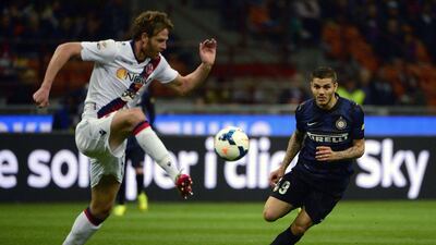 Inter Milan forward Mauro Icardi, right, vies with Bologna defender Cesare Natali during their Serie A on Saturday. Olivier Morin / AFP / April 5, 2014