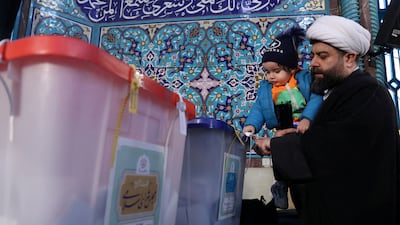 An Iranian cleric casts his vote during parliamentary elections at a polling station in Tehran on Friday. Reuters