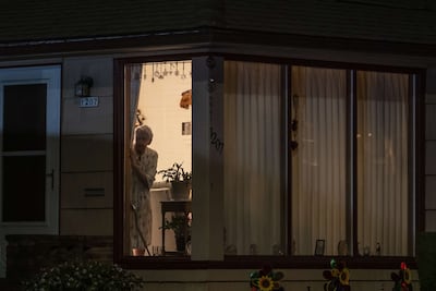 Neighbours watch as Portland police investigate a shooting in Portland, Oregon. Getty Images / AFP