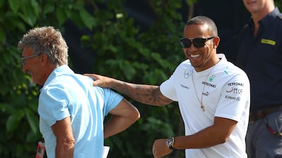 Lewis Hamilton shares a light moment with Eddie Jordan. AP