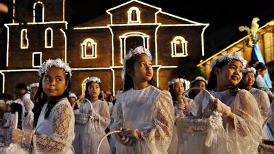 Filipino children participate in a procession before a mass to mark Easter Sunday outside a church in Las Pinas City, south of Manila, Philippines. Francis R Malasig / EPA