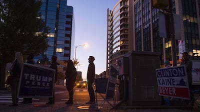 People wait in line to vote at a polling station in Arlington, Virginia. Andrew Caballero-Reynolds / AFP Photo