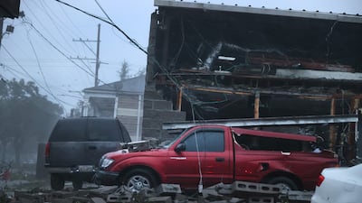 A building collapsed and damaged vehicles during Hurricane Ida in New Orleans, Louisiana. AFP