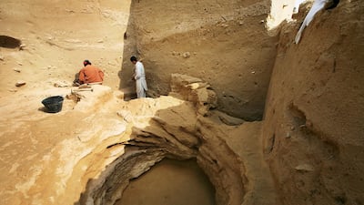 Archaeologists and workers clear bedrock at the Muwaileh Archaeological site in Sharjah. Delores Johnson / The National