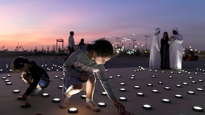 Volunteers set up a 20mx20m light installation, comprised of 2,000 solar lanterns, arranged to reveal the Zayed Sustainability Prize logo.