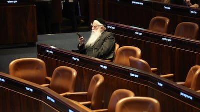An ultra-Orthodox Knesset member sits during a preliminary proposal vote at the Knesset, the Israeli parliament, in Jerusalem. EPA
