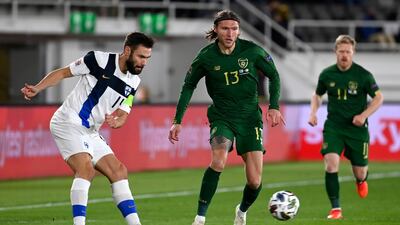 Finland's Tim Sparv under pressure from Jeff Hendrick of Ireland. PA