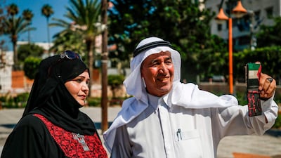 A Palestinian man takes a "selfie" on Palestinian traditional customs day, in Gaza City. AFP