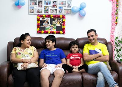 Nagendra with his wife Reena and sons Mudit and Raghuveer. Reem Mohammed / The National
