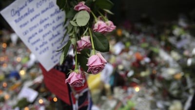 Flowers, notes and candles pay tribute to the victims who died at the Cafe Belle Equipe in Paris. The restaurant was one of the sites targeted by terrorists on November 13, 2015. Kenzo Tribouillard / Agence France-Presse