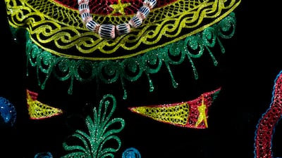 A team member of Cameroon walks during the opening ceremony in the Olympic Stadium at the 2020 Summer Olympics on Friday.