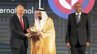 Dr Kamel Assaad Mohanna, President of Amel Association International, receives the Sharjah International Award for Refugee Advocacy and Support from The Ruler of Sharjah, Sheikh Dr Sultan bin Muhammed Al Qasimi. Pictured with Amin Awad, MENA region director for the United Nations High Commissioner for Refugees. Pawan Singh/The National