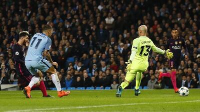 Lionel Messi slots the ball past Manchester City goalkeeper Willy Caballero to give Barcelona a 1-0 lead. Jason Cairnduff / Reuters