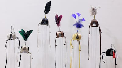 Colourful falcon hoods on display at Abu Dhabi International Hunting and Equestrian Exhibition (Adihex). Chris Whiteoak / The National