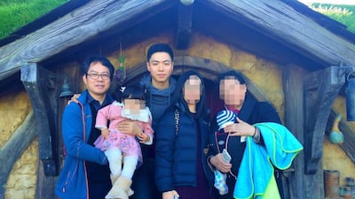 Jie Luo, pictured in 2016 with his father, Hong Xi Luo, and other family members. Photo: Jie Luo