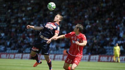 Monaco's Valere Germain, left, in action for Monaco in their game at Nimes that earned them promotion.