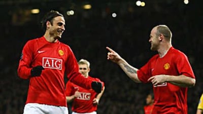 Dimitar Berbatov, left, and Wayne Rooney celebrate as Manchester United coast to victory over Celtic.