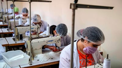 Mask-clad inmates produce protective masks at the Oukacha prison in Casablanca. AFP