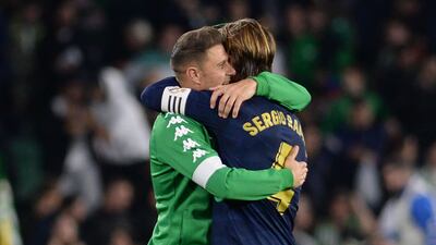 Real Betis midfielder Joaquin hugs Real Madrid defender Sergio Ramos after the final whistle. AFP