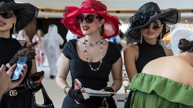 The Dubai World Cup at Meydan Racecourse in Dubai; Sedra Samer, in red hat, with her twin sister Nasab Al Jurdy and friend Nirvana Al Jurdy. All photoes by Antonije Robertson / The National