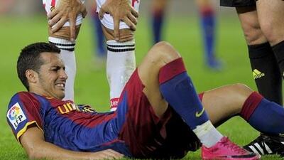 Barcelona's forward Pedro Rodriguez lies injured during the match against Mallorca at Camp Nou.