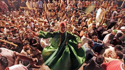 Supporters of Tahir ul Qadri, a populist cleric, listen to his speech during a mass anti-government protest in Islamabad. Bilawal Arbab / EPA